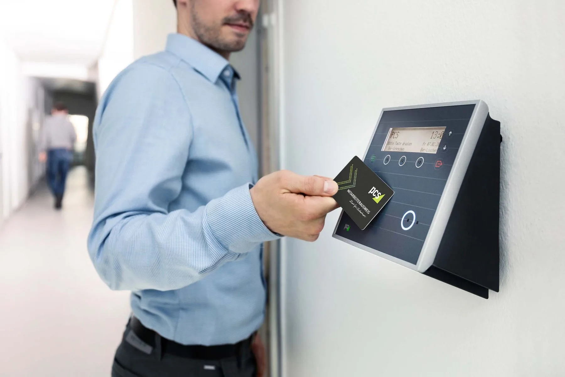 Door access reader beside a modern office entrance