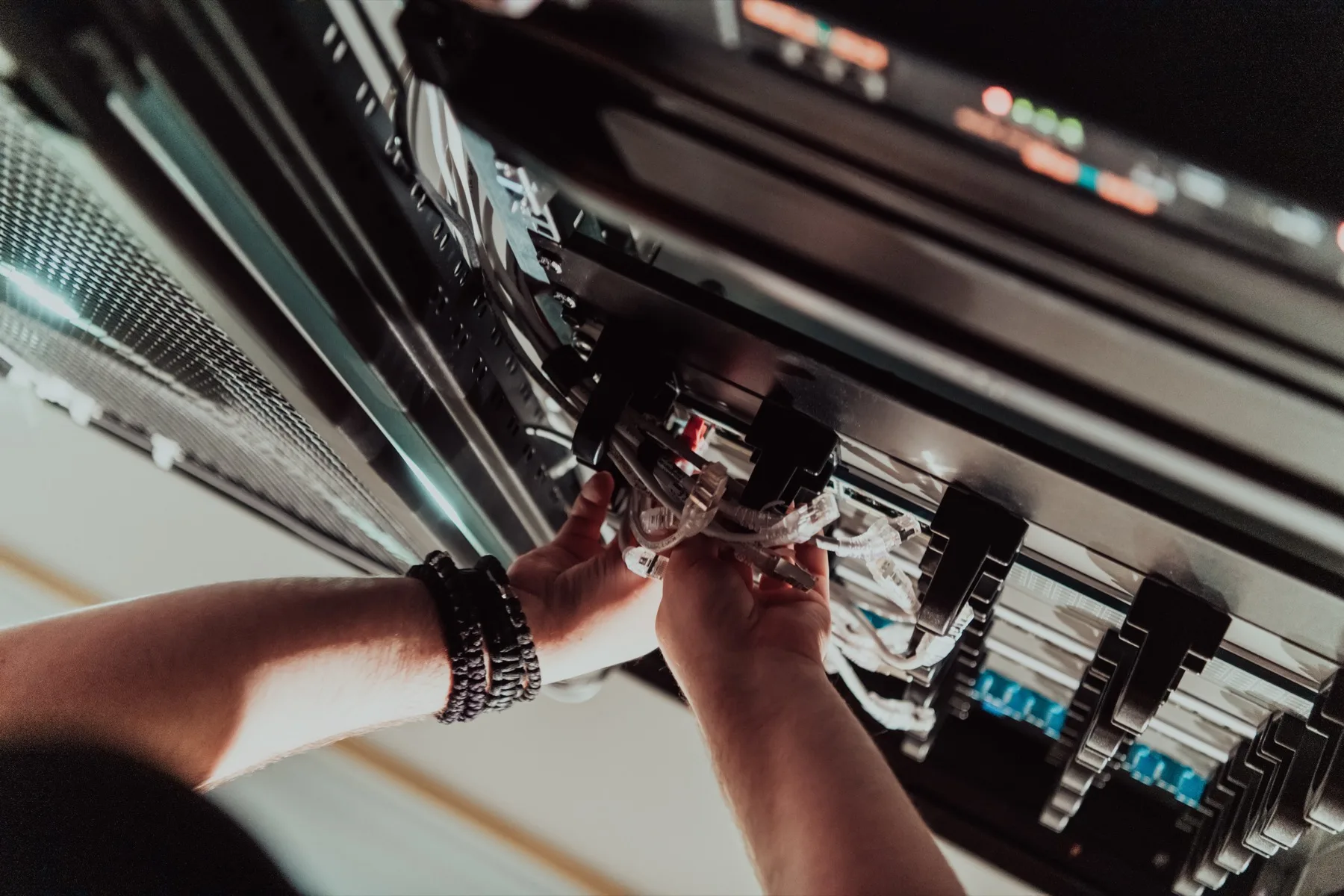 Technician working on rack hardware for office wireless and network services